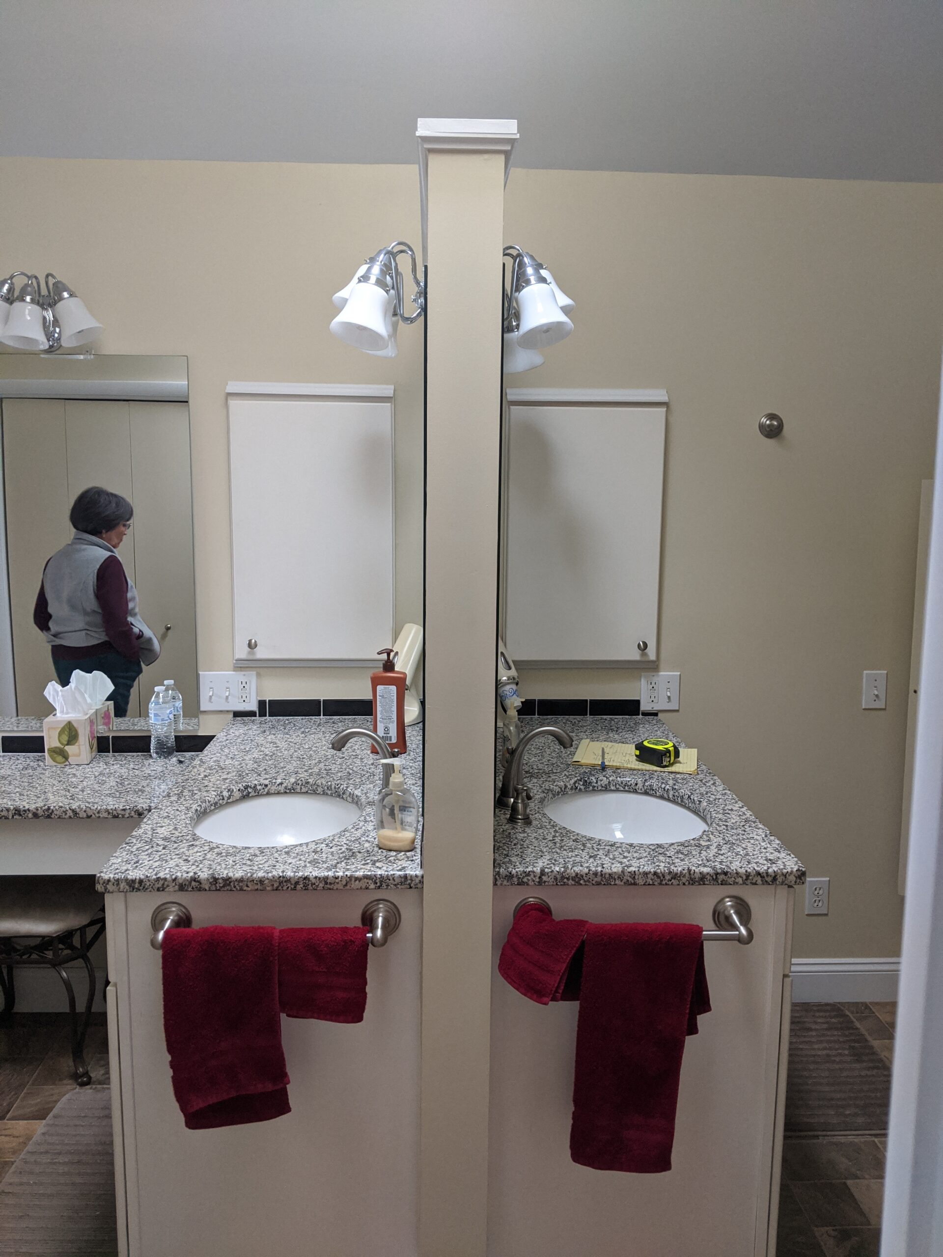This picture is showing the vanities back to back in the middle of the room, it blocked the flow of traffic in the bathroom