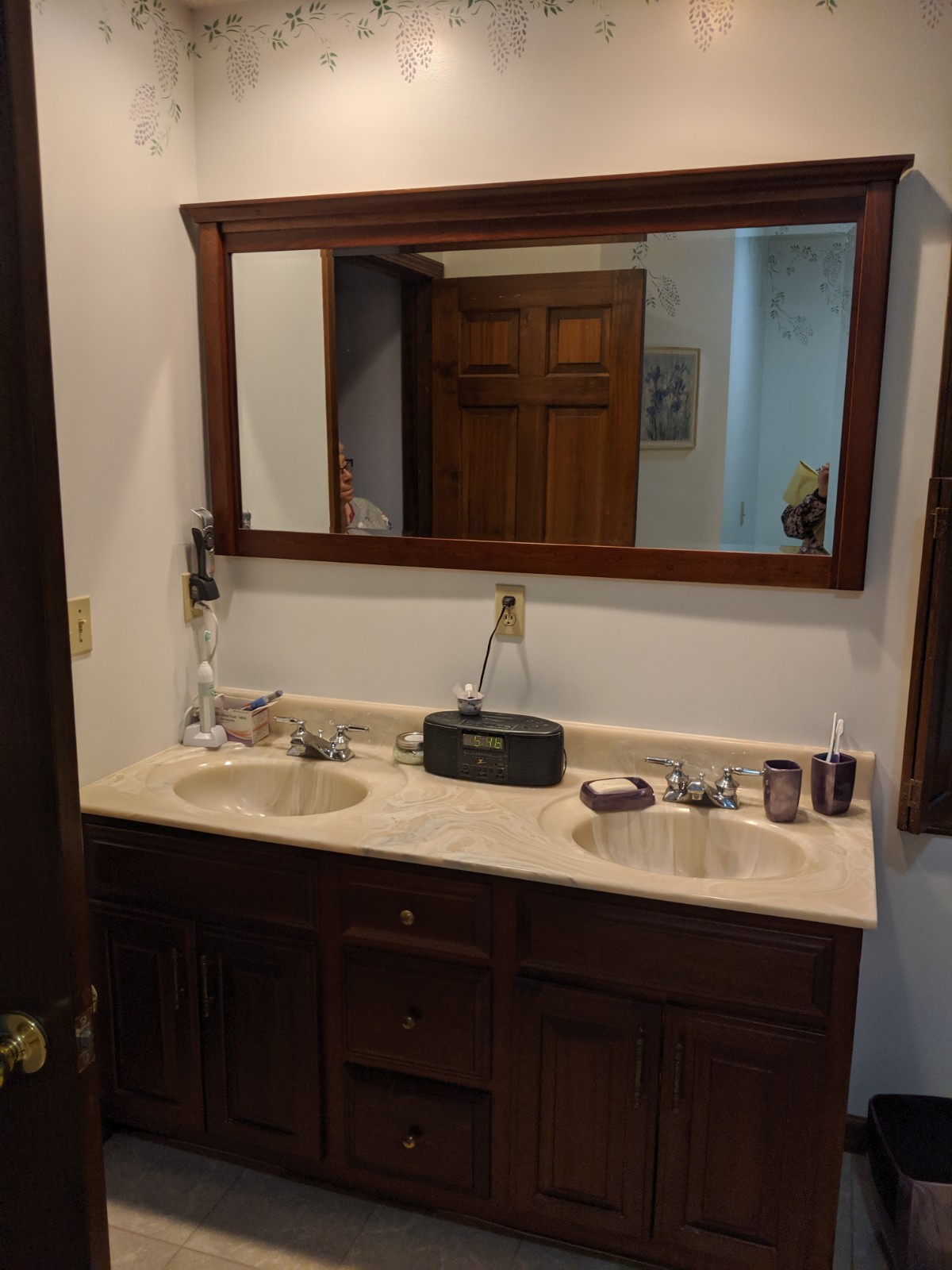 Outdated cultured marble double vanity top with outdated fixtures