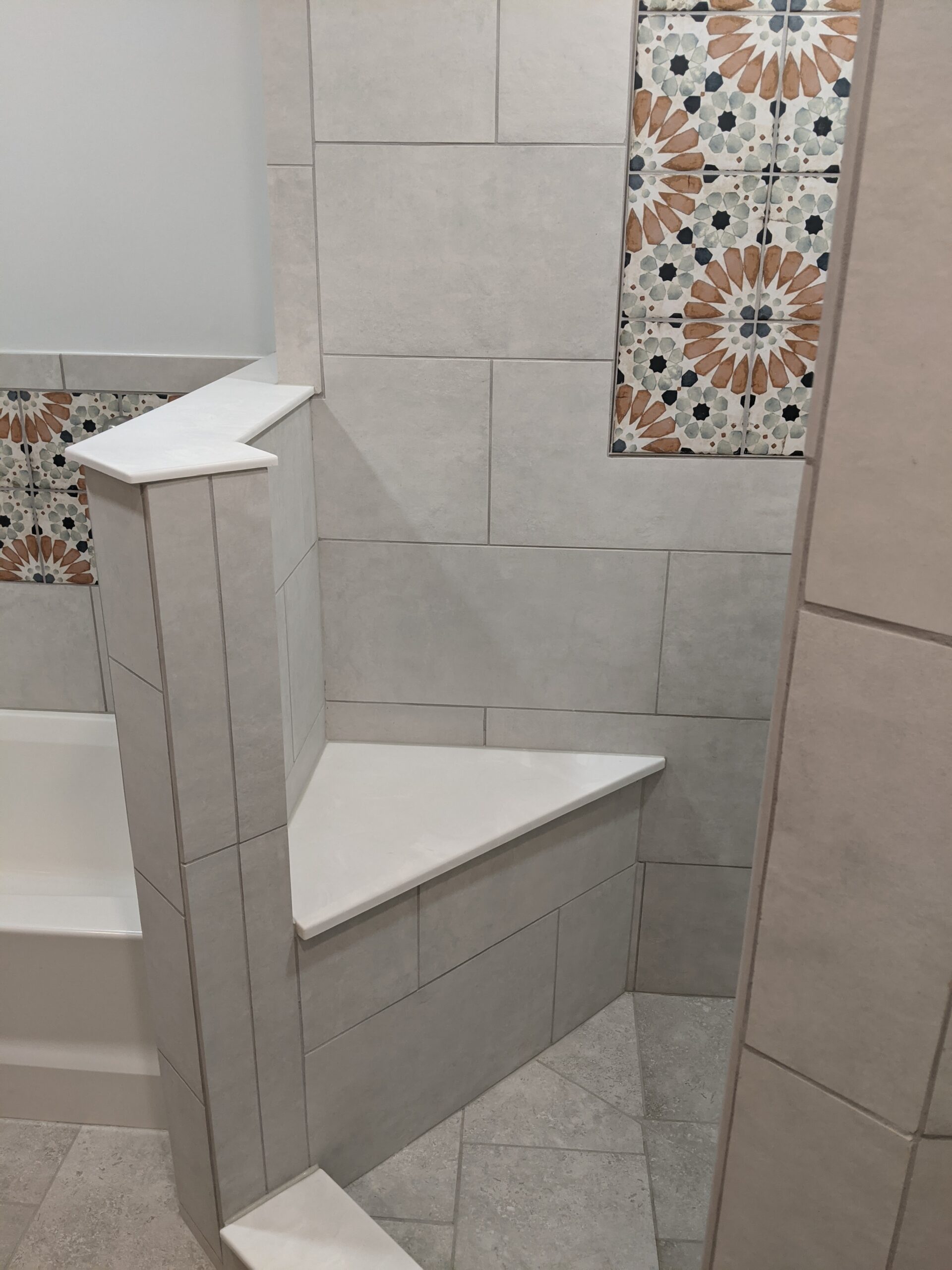 Custom tiled shower with built in custom seat