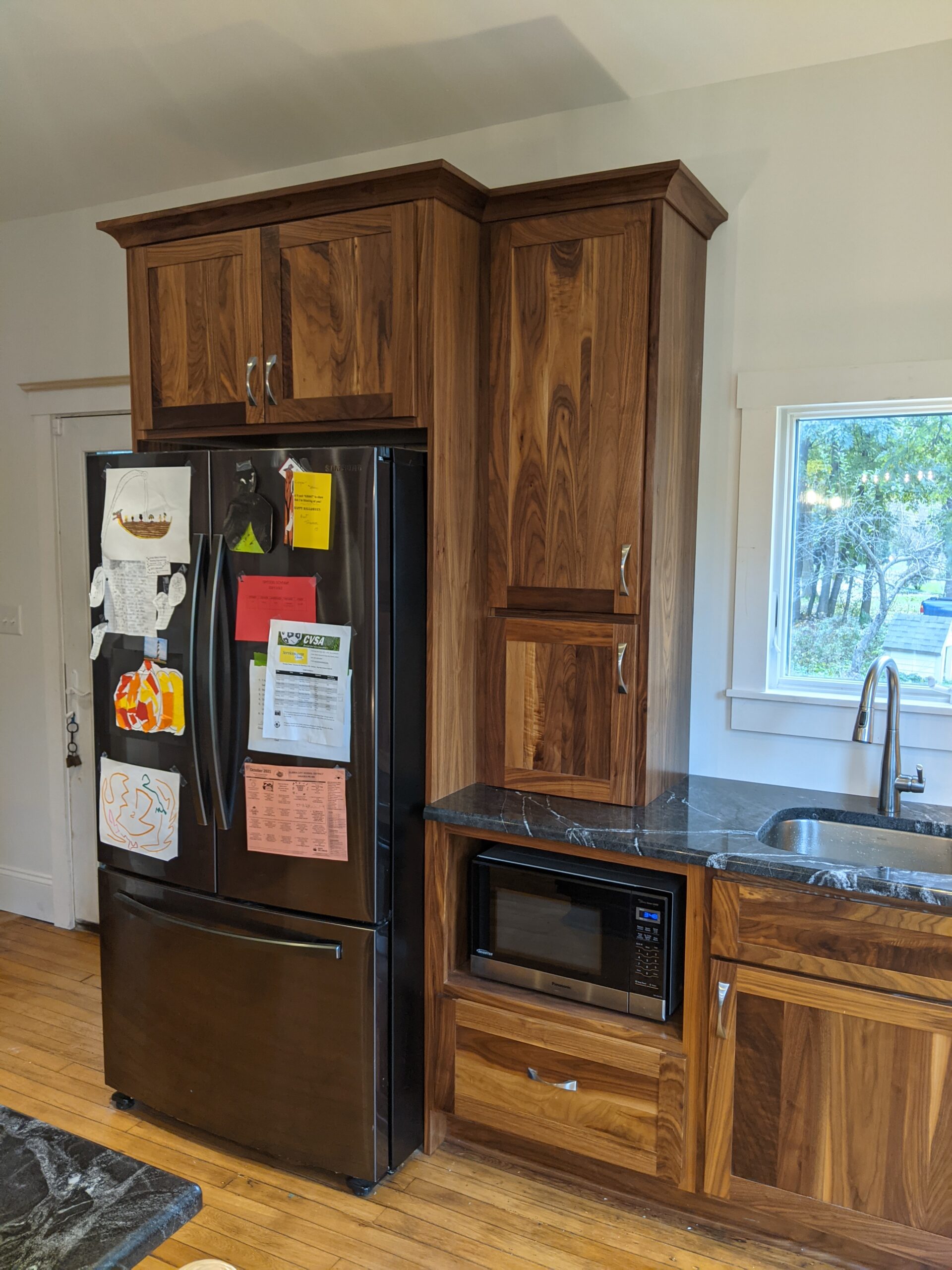 After picture showing the new refrigerator, microwave, coffee area