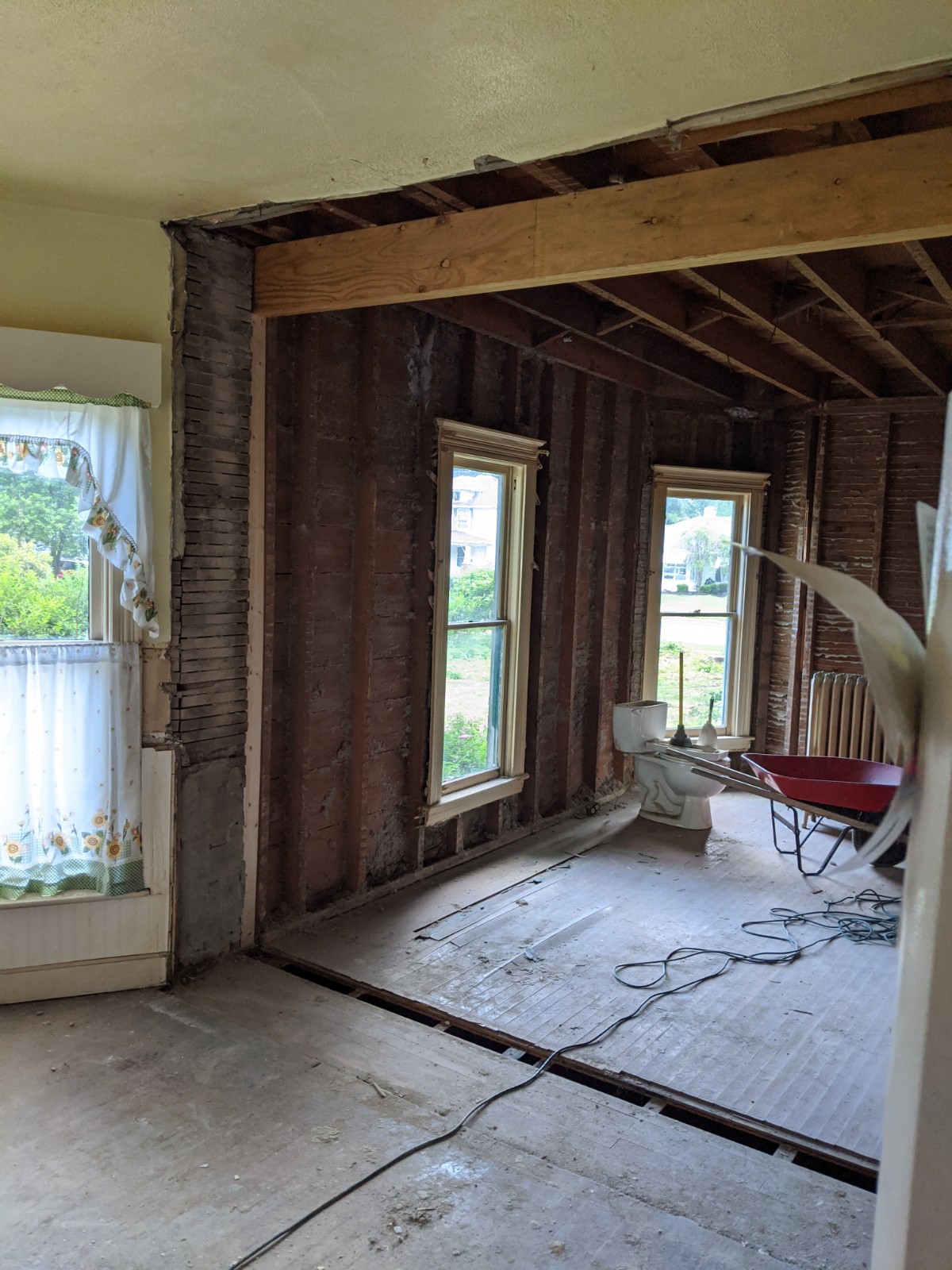 Another view of the wall removed between the kitchen and dining room.